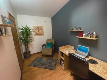 Image showing a well-equipped office with wooden floors and a computer inside a house