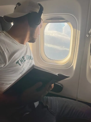 Image showing Juan Rojas, CEO of GoUppers, looking out the window of an airplane.